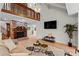 Spacious living room with brick fireplace, hardwood floors, and a loft-style upper level at 1890 Spalding Dr, Atlanta, GA 30350
