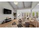 Bright living room with hardwood floors, a vaulted ceiling, and picturesque windows at 1890 Spalding Dr, Atlanta, GA 30350