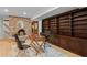 Office featuring built-in shelves, brick fireplace and natural light at 1890 Spalding Dr, Atlanta, GA 30350