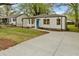 Lovely single-Gathering home with a well-maintained lawn and long concrete driveway at 244 Birch St, Atlanta, GA 30354