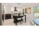 Modern kitchen with an island, stainless steel appliances, and dark-colored cabinetry at 244 Birch St, Atlanta, GA 30354