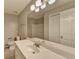 Bathroom featuring a white sink vanity, toilet, storage, and mirror with vanity lights at 3938 Stillwater Dr, Duluth, GA 30096