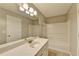 Well-lit bathroom featuring vanity with sink and shower-tub combo at 3938 Stillwater Dr, Duluth, GA 30096