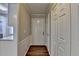 Interior entrance featuring a white door, closet, and wood-look flooring at 3938 Stillwater Dr, Duluth, GA 30096