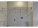 This laundry room has a wire rack, electrical outlets, and plumbing hookups at 3938 Stillwater Dr, Duluth, GA 30096