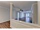 Spacious living area with hardwood floors, neutral paint, view of the fireplace and back patio at 3938 Stillwater Dr, Duluth, GA 30096