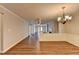 Bright room features hardwood floors, neutral paint colors, and decorative trim at 3938 Stillwater Dr, Duluth, GA 30096