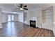 Living area with hardwood floors, built-in shelving, a fireplace, and a glass patio door at 3938 Stillwater Dr, Duluth, GA 30096