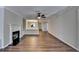Spacious living room showcases wood floors, fireplace, and access to the dining area at 3938 Stillwater Dr, Duluth, GA 30096