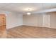 Spacious finished basement featuring wood-look floors and neutral walls, ready for customization at 5040 Fawn Valley Dr, Loganville, GA 30052