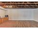 Basement space with laminate and tile flooring, and base cabinets offers potential for customization at 5040 Fawn Valley Dr, Loganville, GA 30052