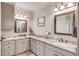 Bright bathroom with double sinks, granite countertops, and modern fixtures at 5040 Fawn Valley Dr, Loganville, GA 30052