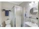 Bathroom featuring a glass-enclosed shower, modern fixtures, and a sleek, stylish design at 5040 Fawn Valley Dr, Loganville, GA 30052