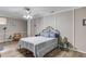 Relaxing bedroom showcasing wood-look floors, a ceiling fan, and a charming, inviting atmosphere at 5040 Fawn Valley Dr, Loganville, GA 30052