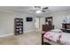 Bedroom featuring neutral carpet, fan, and dark wood furniture at 5040 Fawn Valley Dr, Loganville, GA 30052