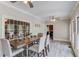 Bright and airy dining room featuring light gray floors and multiple large windows at 5040 Fawn Valley Dr, Loganville, GA 30052