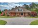 Attractive brick home with a covered front porch, offering curb appeal and charm at 5040 Fawn Valley Dr, Loganville, GA 30052