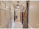 Hallway with a rustic barn door and pendant lights, creating a warm and inviting space at 5040 Fawn Valley Dr, Loganville, GA 30052