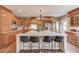 Well-equipped kitchen with a spacious island, seating, and wood cabinetry, ideal for Gathering gatherings at 5040 Fawn Valley Dr, Loganville, GA 30052