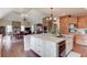 Spacious kitchen features an island, wood cabinets, and stainless steel appliances at 5040 Fawn Valley Dr, Loganville, GA 30052
