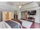 Spacious main bedroom with hardwood floors, tray ceilings, and natural light at 5040 Fawn Valley Dr, Loganville, GA 30052