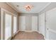 Bright mud room with tiled floor and multiple doors and closets for organization and functionality at 5040 Fawn Valley Dr, Loganville, GA 30052