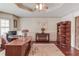 Well-appointed office space with built-in shelving, wood floors, and natural light for comfortable working at 5040 Fawn Valley Dr, Loganville, GA 30052