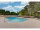 Backyard swimming pool with diving board and slide, alongside a wooden gazebo and ample seating space at 5040 Fawn Valley Dr, Loganville, GA 30052