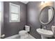 A half bathroom features a pedestal sink, tile flooring, and a window with blinds at 3920 High Dove Sw Way # 11, Smyrna, GA 30082