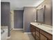 Spacious bathroom featuring double sinks, modern fixtures, and a separate shower and tub at 3920 High Dove Sw Way # 11, Smyrna, GA 30082