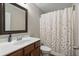 Bathroom features a vanity with a white countertop and a shower with a floral curtain at 3920 High Dove Sw Way # 11, Smyrna, GA 30082