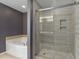 A tiled shower featuring a sliding glass door is adjacent to a soaking tub at 3920 High Dove Sw Way # 11, Smyrna, GA 30082