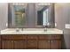 Bathroom with a double vanity featuring framed mirrors and modern fixtures at 3920 High Dove Sw Way # 11, Smyrna, GA 30082