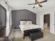 A serene main bedroom featuring modern design, a dark accent wall, and a plush, inviting bed at 3920 High Dove Sw Way # 11, Smyrna, GA 30082