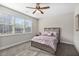 Bedroom with a window, ceiling fan, and a bed with pillows at 3920 High Dove Sw Way # 11, Smyrna, GA 30082