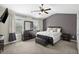 Comfortable bedroom featuring a dark dresser, bench and windows, creating a serene retreat at 3920 High Dove Sw Way # 11, Smyrna, GA 30082
