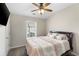 A bedroom with a queen size bed has neutral colors and a ceiling fan at 3920 High Dove Sw Way # 11, Smyrna, GA 30082