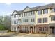 Attractive exterior view of the townhouse community with brick and dark shutters at 3920 High Dove Sw Way # 11, Smyrna, GA 30082