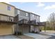 Rear view of condo units with garage parking and individual deck at 3920 High Dove Sw Way # 11, Smyrna, GA 30082