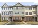 Charming exterior view of townhome community with brick and manicured lawns at 3920 High Dove Sw Way # 11, Smyrna, GA 30082