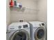 Laundry room features side-by-side Samsung washer and dryer appliances at 3920 High Dove Sw Way # 11, Smyrna, GA 30082