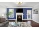 Cozy living room features a fireplace, ample natural light, and modern decor at 3920 High Dove Sw Way # 11, Smyrna, GA 30082