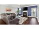 Comfortable living room with fireplace, tv, neutral colored sofa, and dark wood floors at 3920 High Dove Sw Way # 11, Smyrna, GA 30082