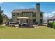 Beautiful backyard view with patio, hot tub, well-manicured lawn, and mature trees at 4030 Gold Mill Rdg, Canton, GA 30114