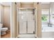 Well-maintained bathroom featuring a separate tub and shower, tile floors, and natural light at 4030 Gold Mill Rdg, Canton, GA 30114