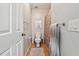 Cozy bathroom features a toilet, patterned shower curtain, towel rack, and neutral colored tiled floor at 4030 Gold Mill Rdg, Canton, GA 30114