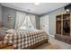 Cozy bedroom with neutral colors, comfortable bedding, and natural light streaming through the window at 4030 Gold Mill Rdg, Canton, GA 30114