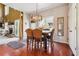 Dining room with hardwood floors, and decorative light fixture adjacent to the living room at 4030 Gold Mill Rdg, Canton, GA 30114