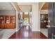 Welcoming foyer with hardwood floors, built-in cabinetry, and views into the living spaces at 4030 Gold Mill Rdg, Canton, GA 30114