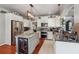 Stylish kitchen featuring white cabinetry, stainless steel appliances, and a granite island with wine storage at 4030 Gold Mill Rdg, Canton, GA 30114